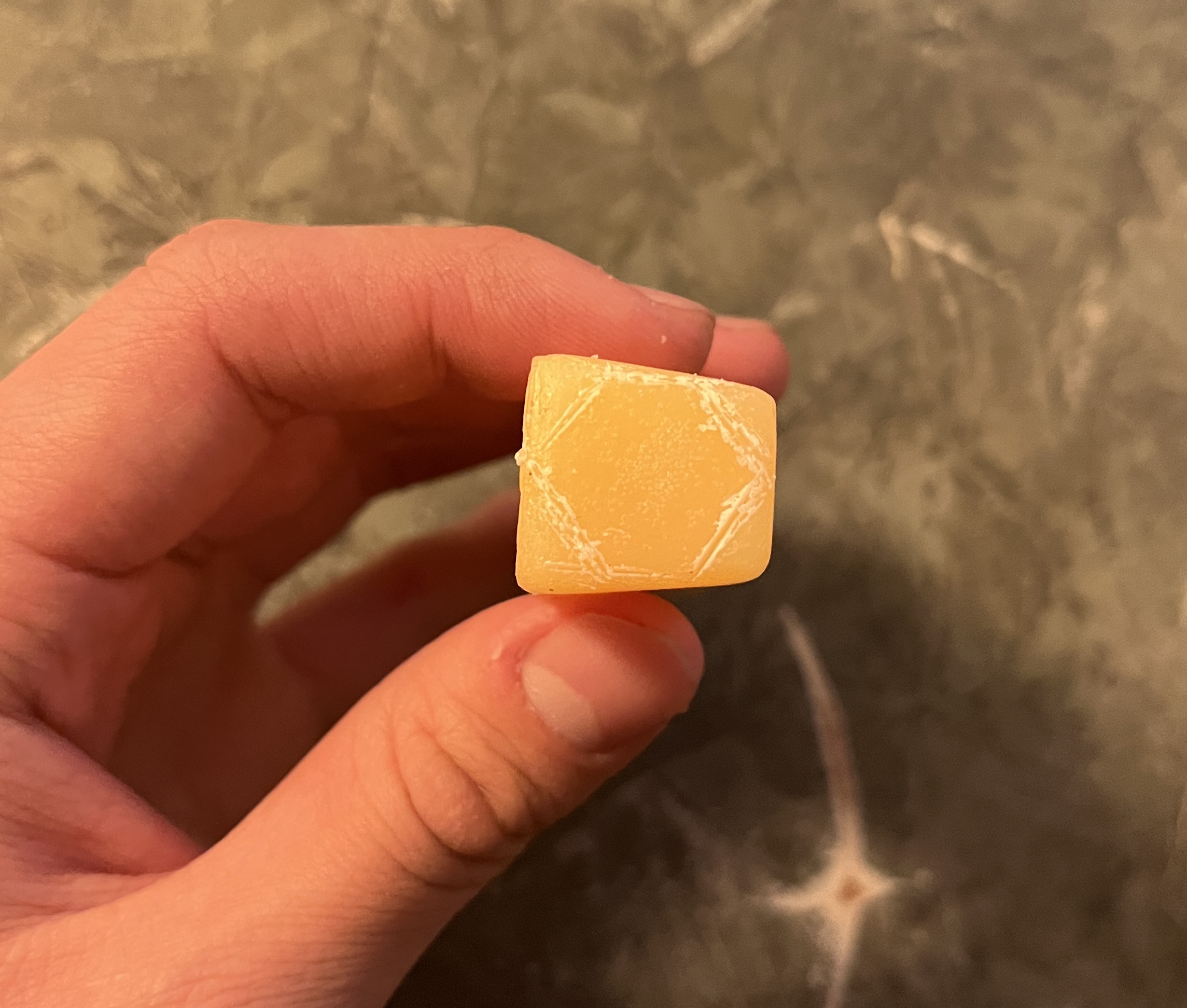 A stick of beeswax I had, with a hexagon outline traced out