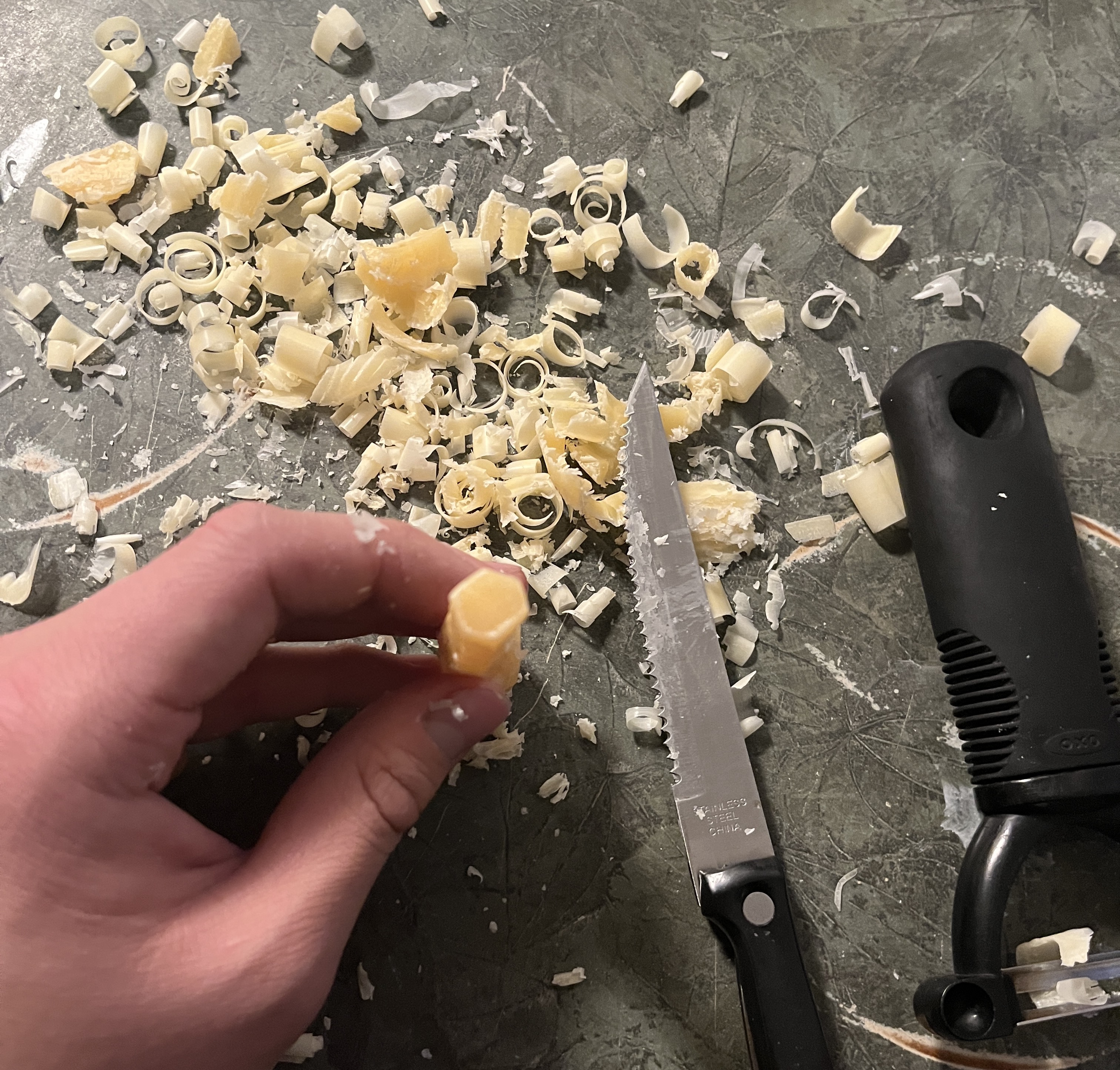 Manually shaved beeswax stick with steak knife and vegetable peeler. Does not look very hexagonal and took a lot of effort :(