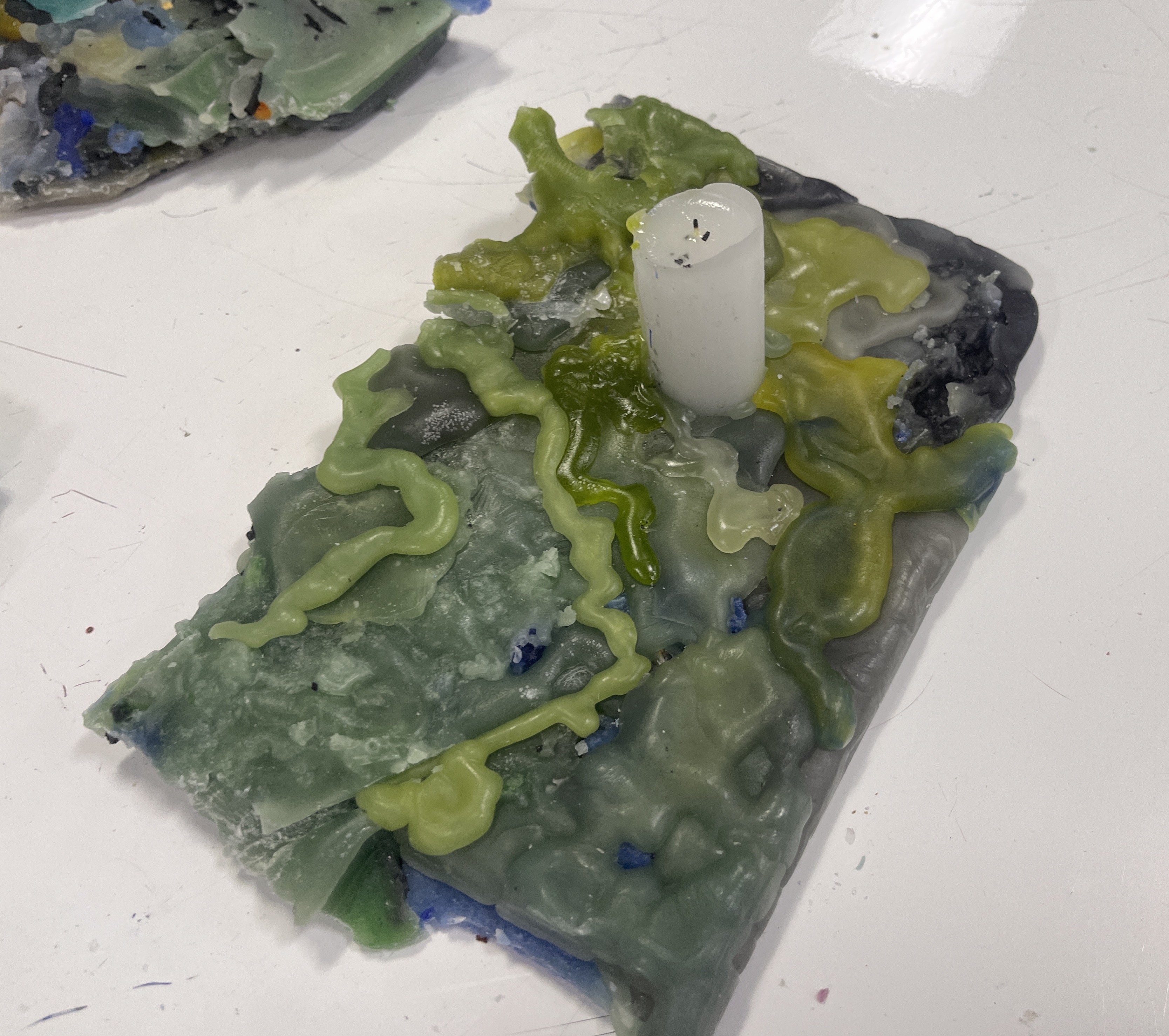 Green Lighthouse (2022), wax and wick and wood